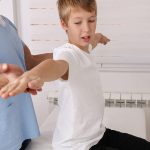Child receiving Back-to-school physical